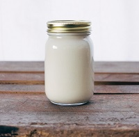 jar of homemade sweetened condensed milk