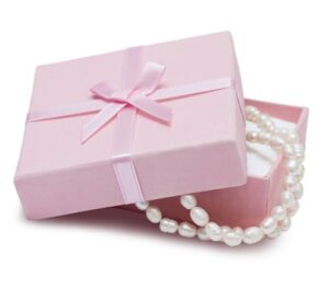 pink jewelry box with pearl necklace