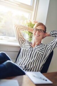 relaxed woman in well setup home office