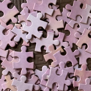 Pink jigsaw puzzle pieces