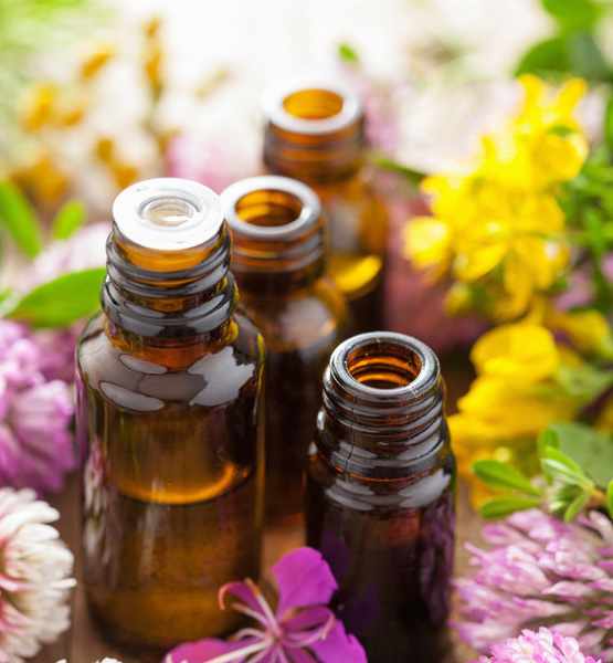 essential oils amber bottles with flowers