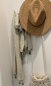 Using hooks in small spaces for hat bag and scarf